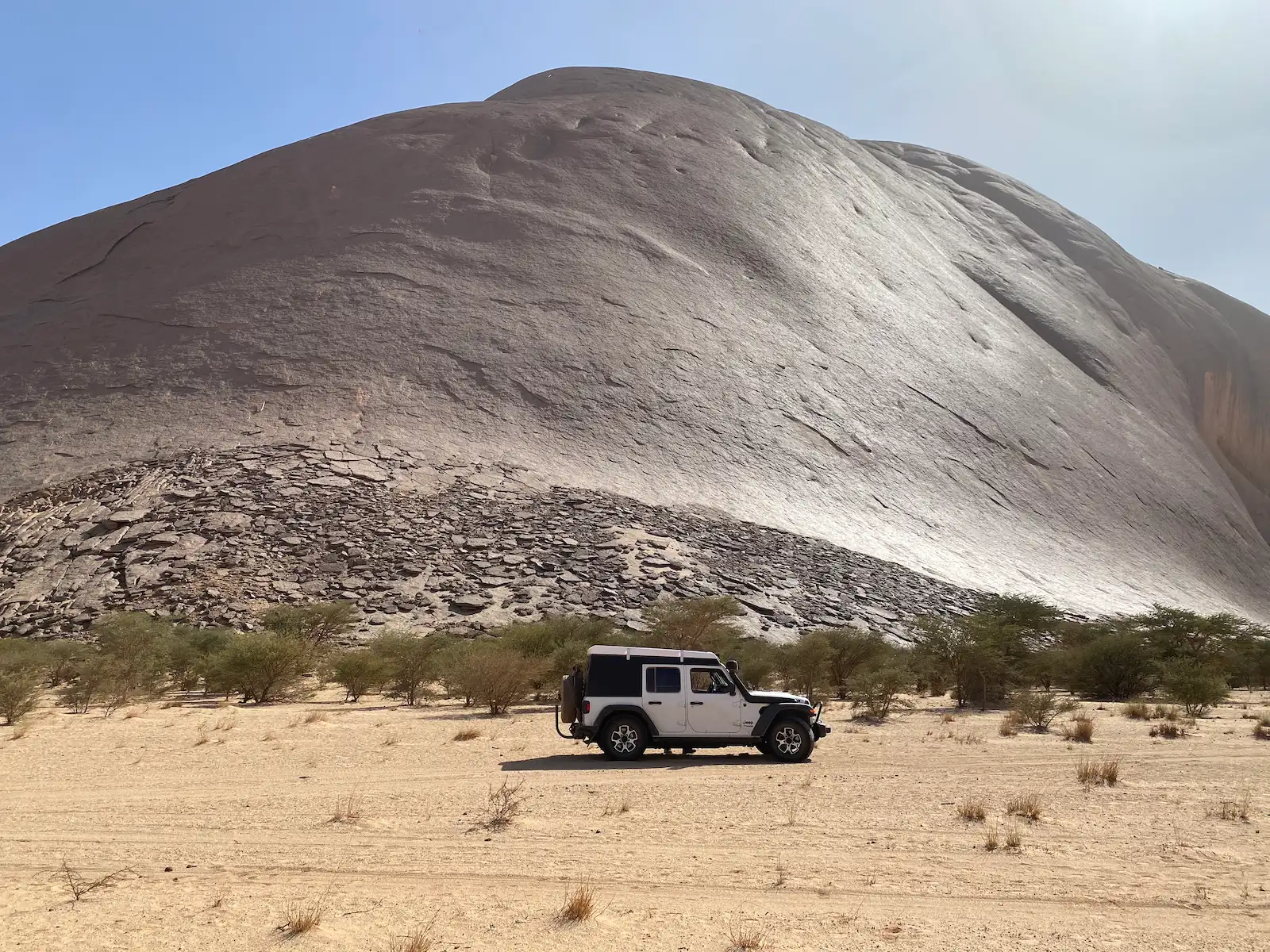 Jeep Wrangler Rubicon overlanding at Ben Amera monolith in Mauritania