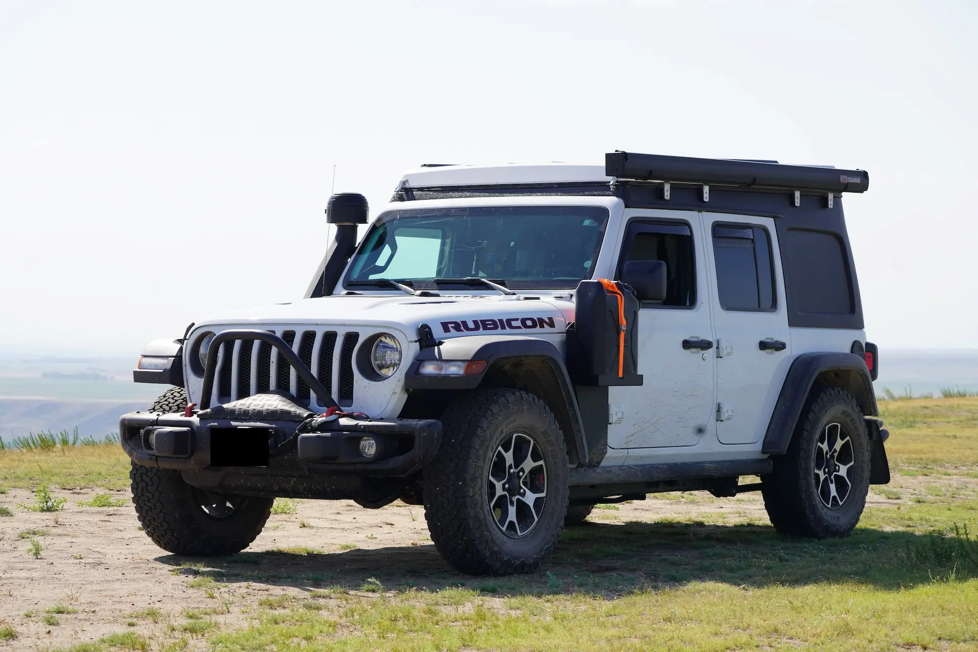 Jeep Wrangler Rubicon at a scenic location during an overland world journey