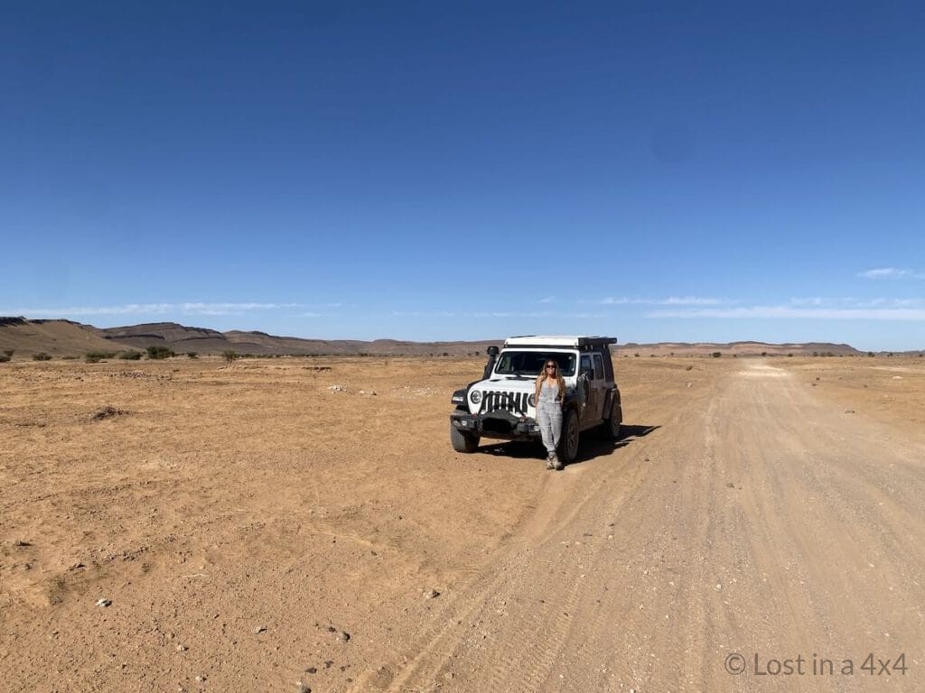 Me standing next to our Jeep on the desert 4x4 track from Rissani to Ramlia on the way to the Lost City of Bah Haoudou in Morocco
