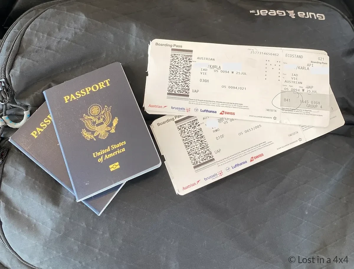 American passports and boarding passes to Austria on top of Gura Gear camera bag at Washington DC airport
