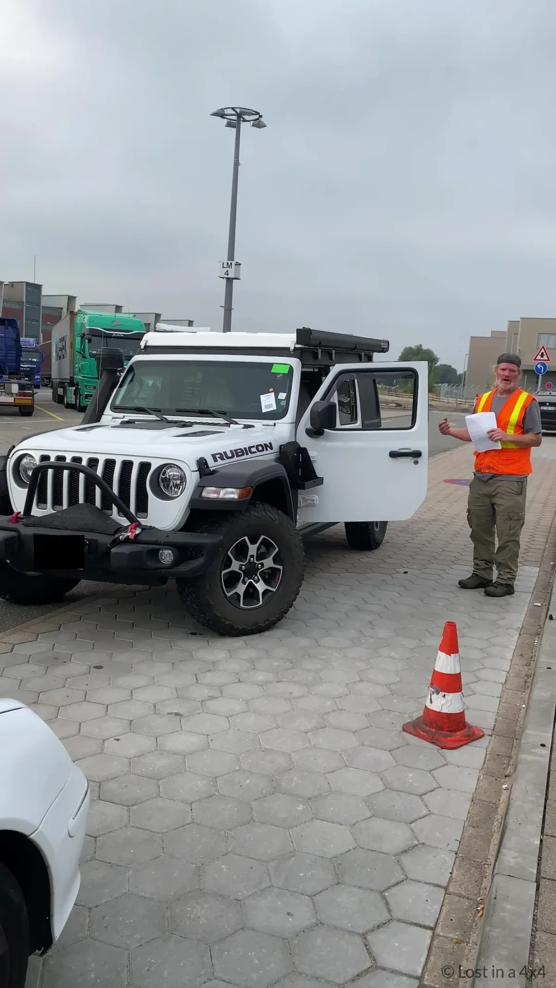 Brett standing next to Jeep outside Hamburg port after collection following shipping from USA to Europe