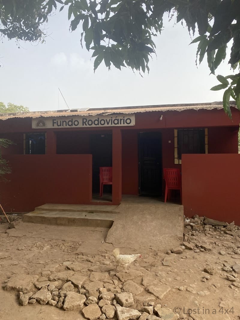 Road tax payment office at the Guinea-Bissau border post where travelers complete vehicle entry formalities.
