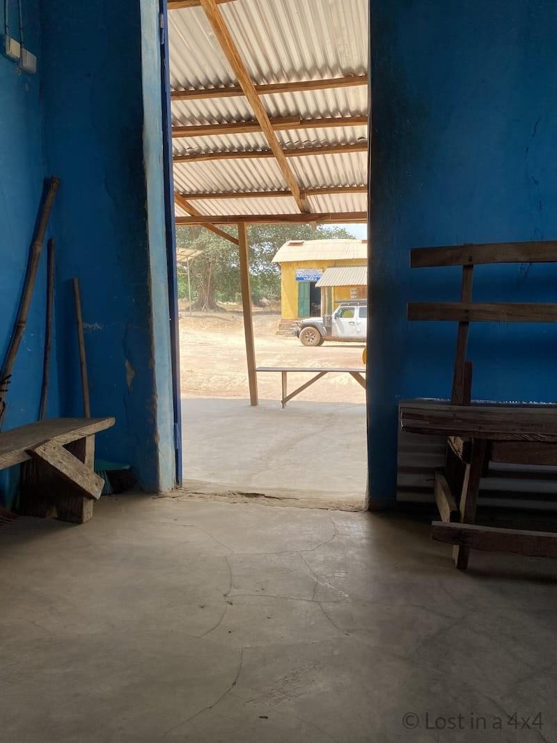 View of the Guinea douane (customs) office at the Kandka border post taken from inside a building across the street.
