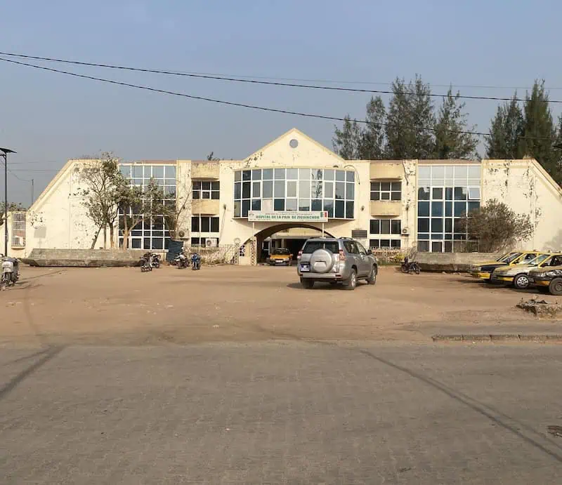 Exterior view of Hôpital de la Paix in Ziguinchor Senegal from across the street.
