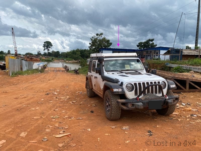 Jeep Wrangler parked beside the Côte d’Ivoire border post offices during overland crossing from Liberia.