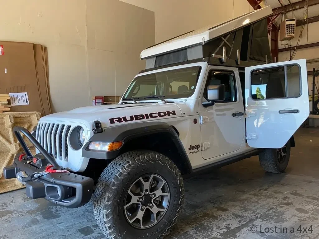 Side view of a Jeep Wrangler Rubicon with Ursa Minor pop-top camper roof installed in Oregon, USA.