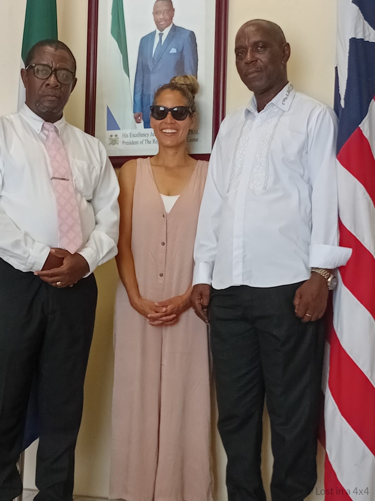 Karla with the Ambassador of Liberia at the Liberian Embassy in Sierra Leone during an overland visa application journey in West Africa.