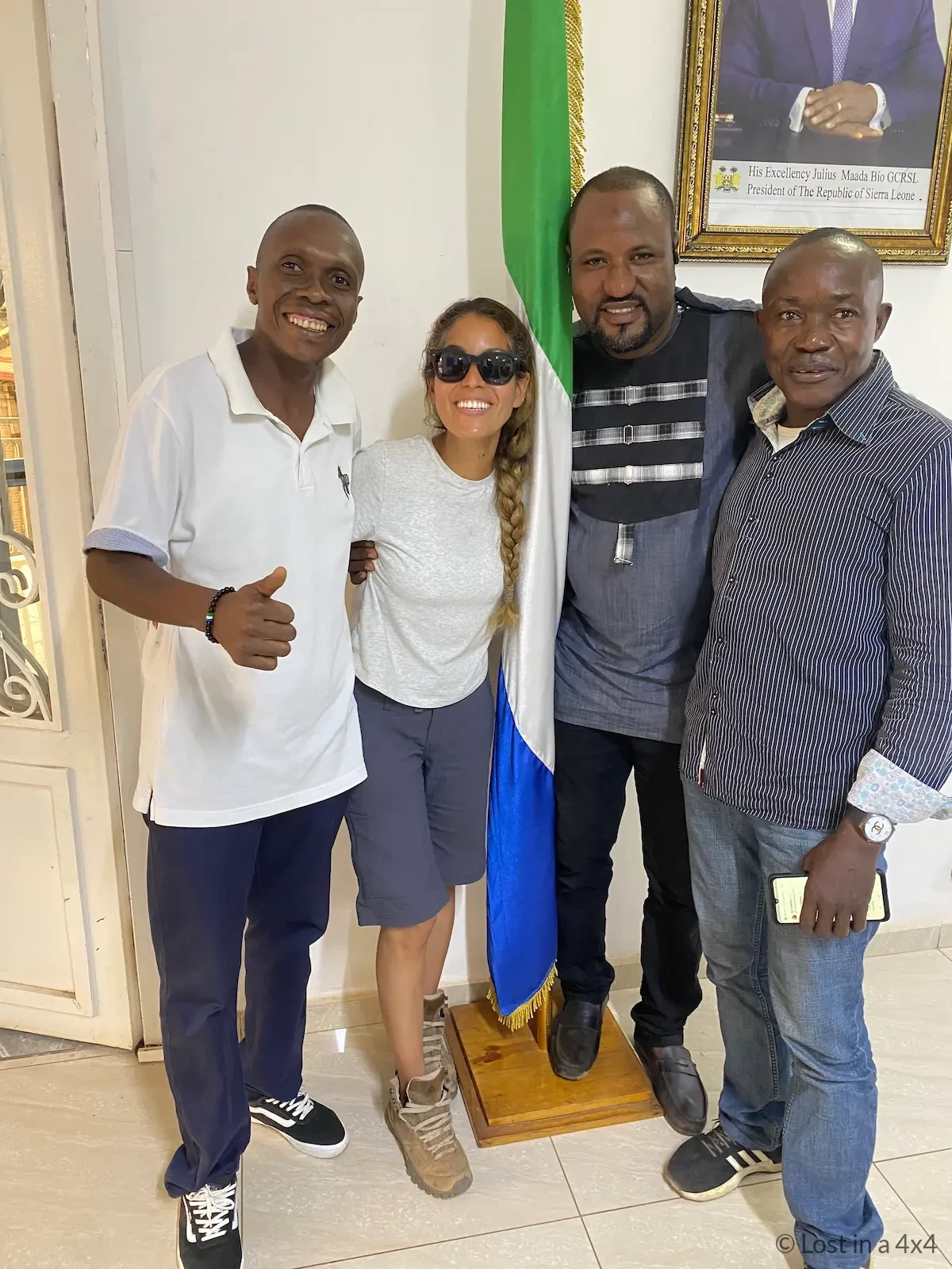 Karla standing together with staff at the Embassy of Sierra Leone in Conakry, Guinea