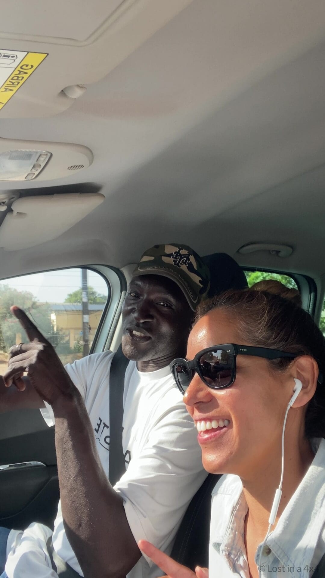 Driver and passenger on the way back to Somone from Kaolack in Senegal