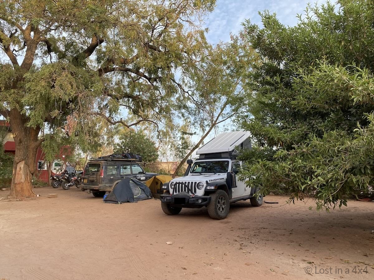 Overland Jeep with Ursa Minor roof top tent at a campsite in Senegal beside another overland vehicle
