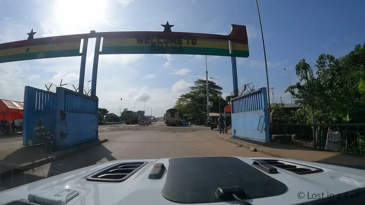 Welcome to Ghana sign at the end of the bridge connecting Ivory Coast and Ghana at the Noé–Elubo border crossing.