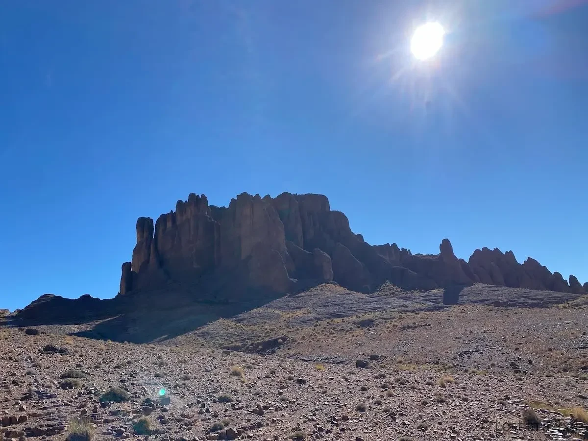 Finger-like rock formations rising from the desert landscape near Pâte de l'Éléphant in Morocco.