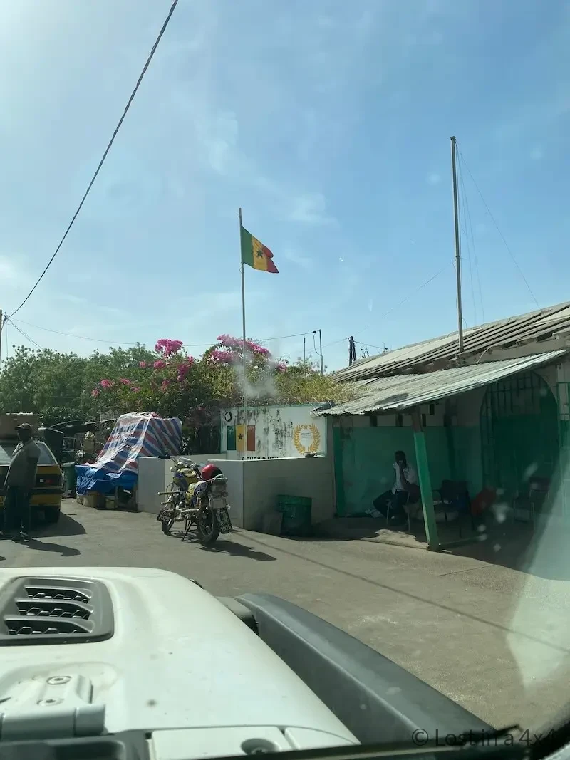 Senegal national flag flying outside the customs office at Sénoba Border Post.