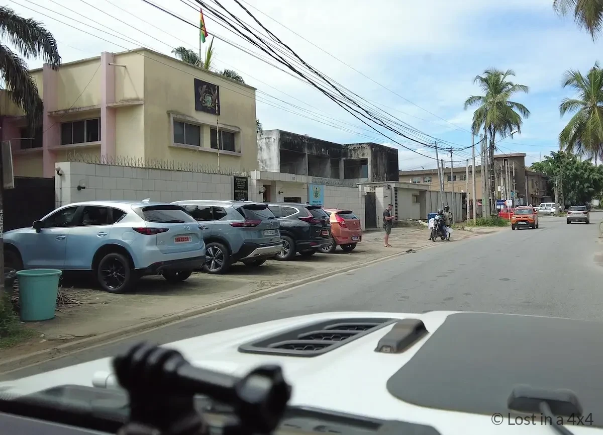 View of the Ghana Embassy in Abidjan, Côte d'Ivoire, photographed from inside our Jeep Wrangler while obtaining a Ghana visa during our overland journey through Africa.