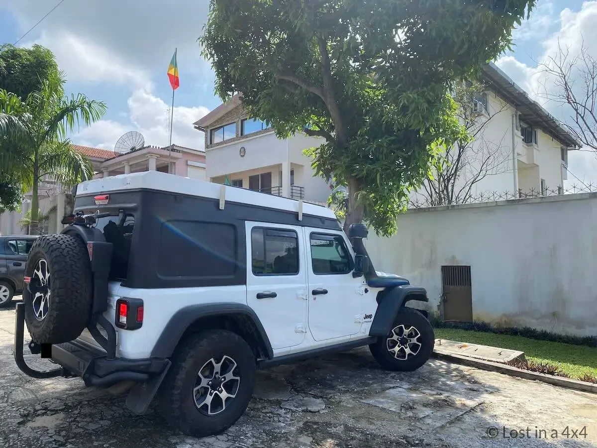Our Jeep Wrangler parked outside the Embassy of the Republic of the Congo in Abidjan, Côte d'Ivoire, where we obtained our Republic of the Congo visa.
